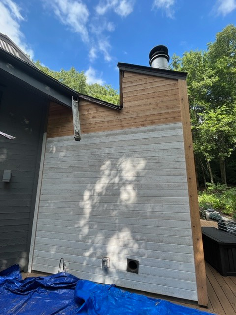 Siding repair in progress on a house exterior by Cedar Siding Repair in Centerville, OH.