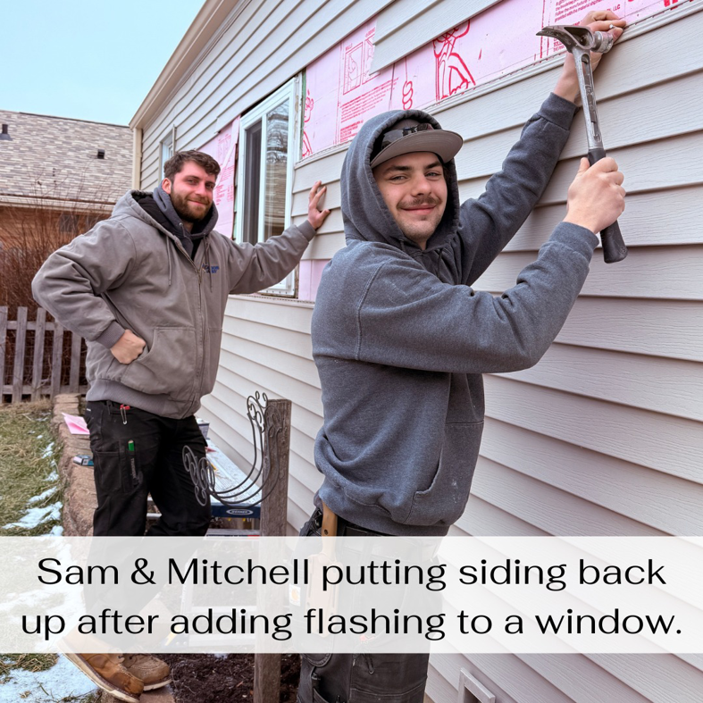 Sam and Mitchell from Odd Job Larry repairing siding and adding window flashing on a house in Kenosha, WI.