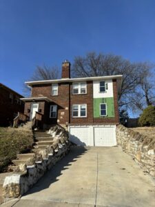Siding and window installation in progress on a brick house by Rios Siding & Windows in Blue Springs, MO