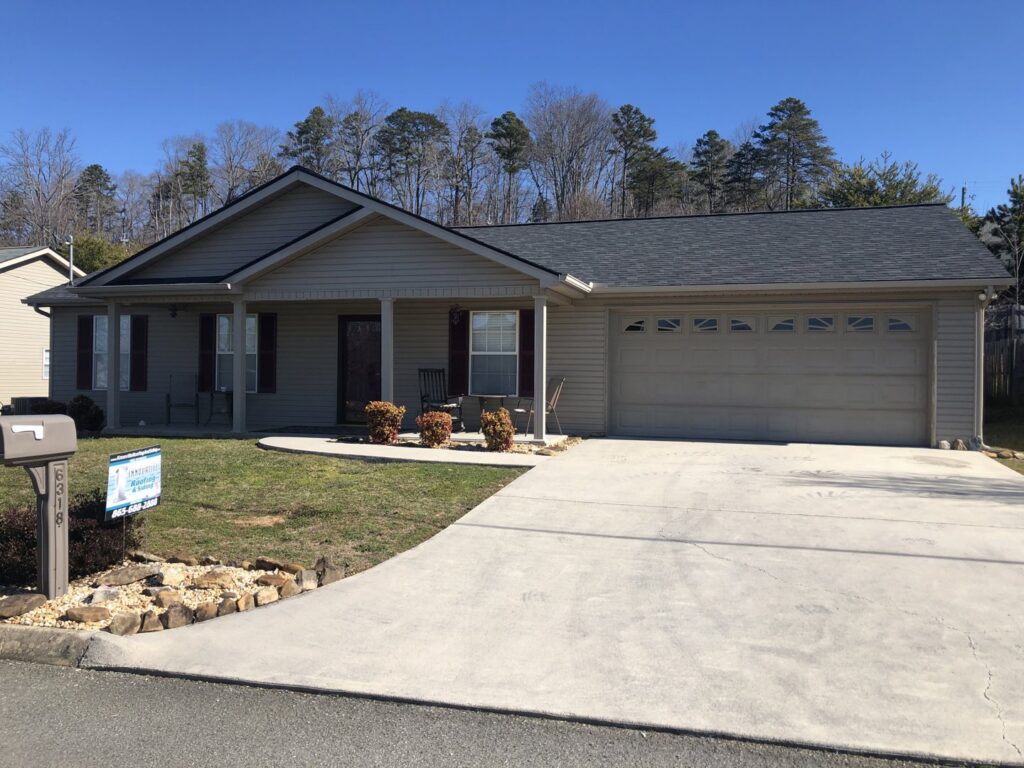 A single-story home with a newly installed roof by Innovative Roofing & Siding Inc in Knoxville, TN.