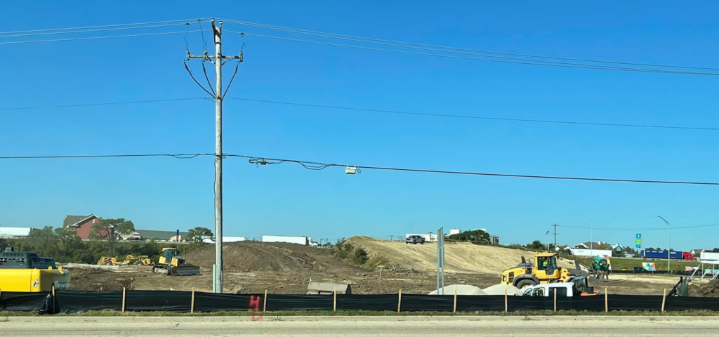 Heavy machinery performing site preparation at a construction project by R A Seaton Contractor Services in Rockford, IL.