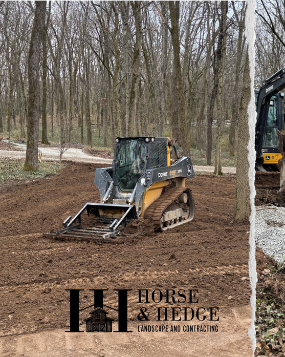 Skid steer performing land leveling for landscape contracting by HorseandHedge in Lexington, KY.