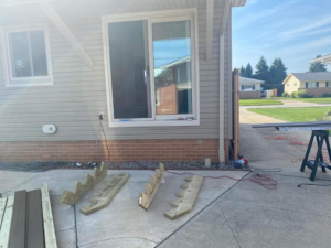 New sliding door installation and patio work in progress by Indoor/Outdoor Home Repairs in Parma, OH.