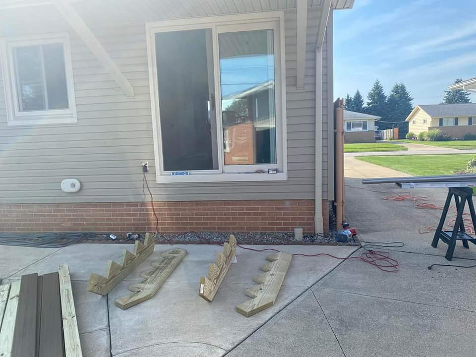New sliding door installation and patio work in progress by Indoor/Outdoor Home Repairs in Parma, OH.