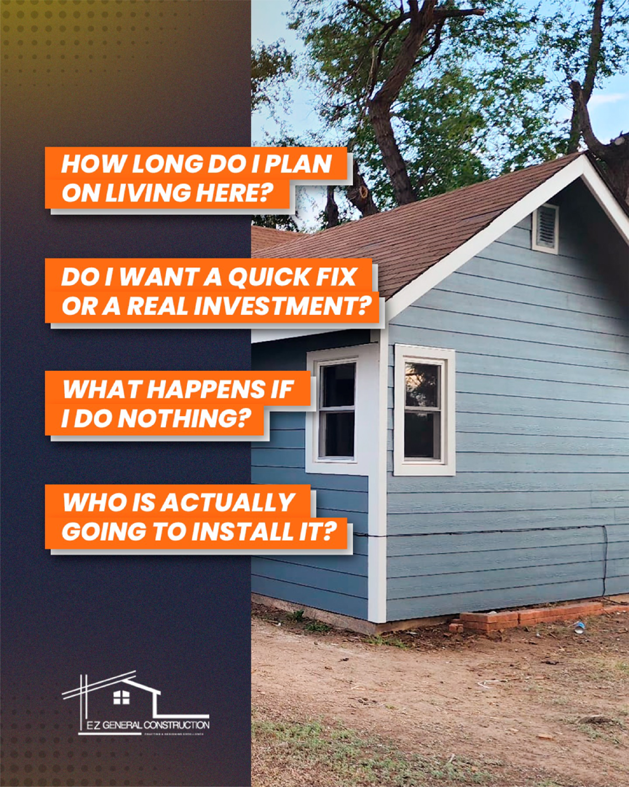 A small house featuring newly installed blue siding and white trim by EZ General Construction LLC in Colorado Springs, CO