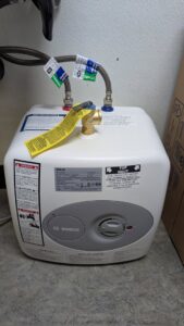A new small Bosch water heater unit installed by DemoCraft Commercial Services in Everett, WA