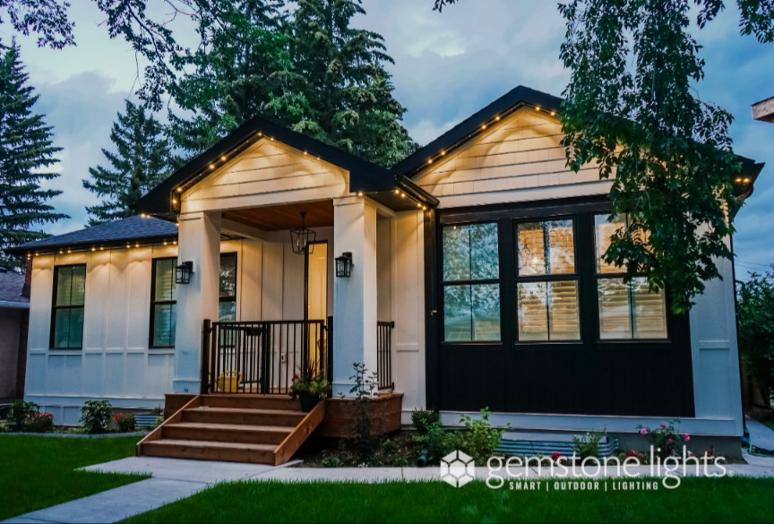 A modern home illuminated at dusk with smart outdoor lighting installed by Lux Outdoor Smart Lighting in Bend, OR.