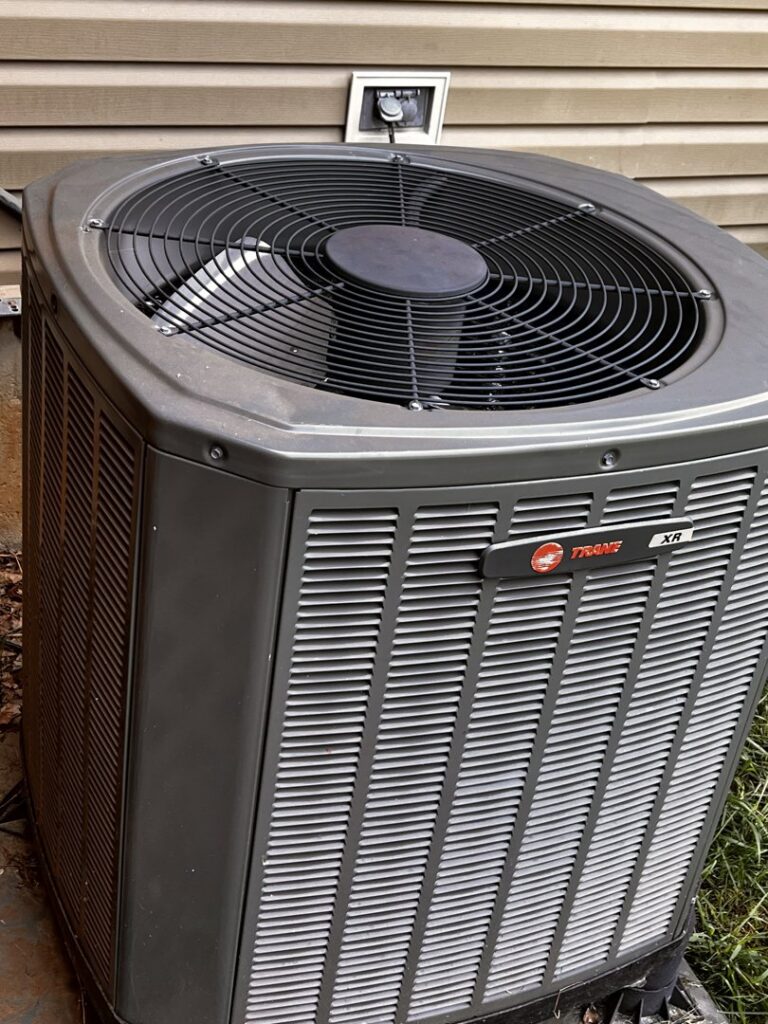 A newly installed smart thermostat showing room temperature, installed by Solar Flare Heating & Air in Dayton, OH.