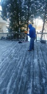 A professional snow removal service being performed on a residential deck by C&C LAWN CARE,MOVING & TRASH REMOVAL in Baltimore, MD