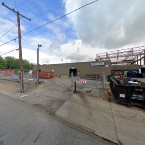 Exterior view of Southside Recycling facility with large junk and recycling containers in Youngstown, OH