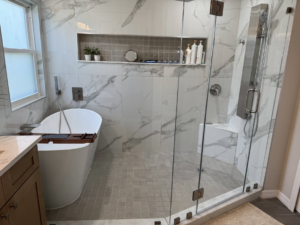 A spacious bathroom remodel with a large walk-in shower and freestanding tub completed by Amazing Spaces 21 in Orlando, FL