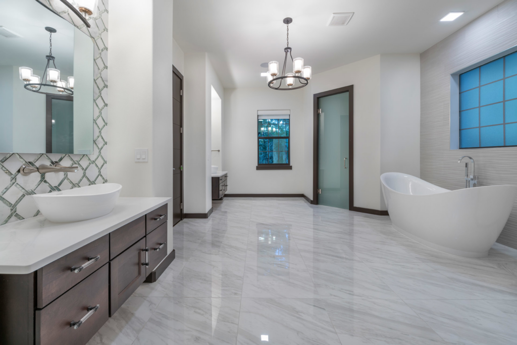 A spacious modern bathroom renovation with a freestanding tub by Cornerstone Custom Construction LLC in Beaver Falls, PA