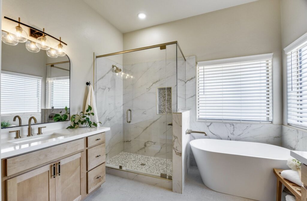 A spacious bathroom renovation featuring a walk-in shower and freestanding tub by AZ New Bath in Glendale, AZ