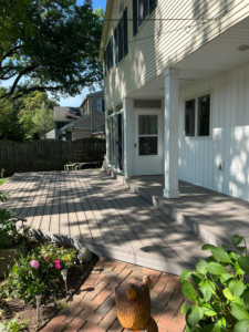Spacious composite deck and patio area built by Do It All Contracting for a home in Rochester, NY.