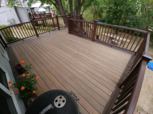 A spacious, finished outdoor deck surface with railings, built by Custom Remodeling Inc. in Houston, TX.
