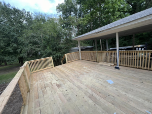 A spacious new wooden deck with sturdy railings, expertly built by JD Handyman service LLC in Miami, FL.