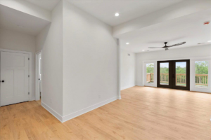 Spacious room with light hardwood floors expertly installed or refinished by WoodHaven Floor Refinishing in Georgetown, KY.