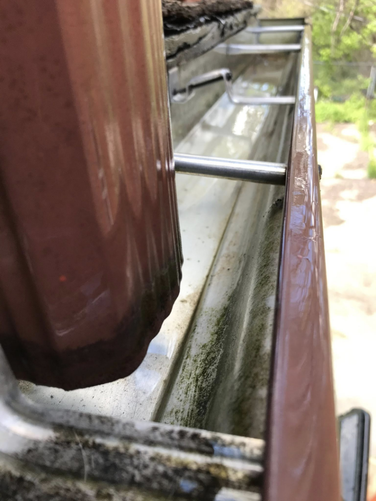 A sparkling clean gutter after professional cleaning service by Applied Pressure LLC in Detroit, MI.