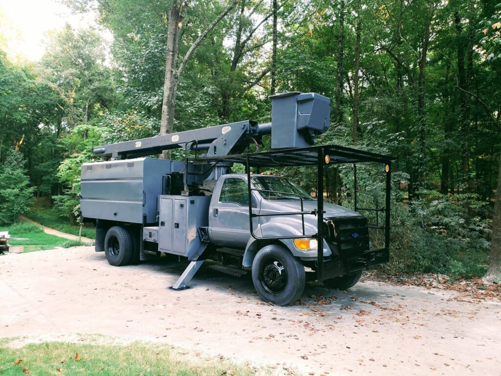 A specialized bucket truck used for tree service operations by All Star Tree Service in Memphis, TN.