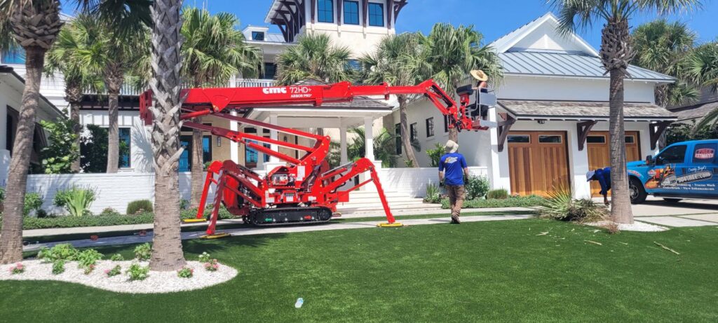 A spider lift set up for palm tree service by 904tree.com in Jacksonville, FL.