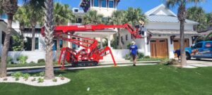 A spider lift set up for palm tree service by 904tree.com in Jacksonville, FL.