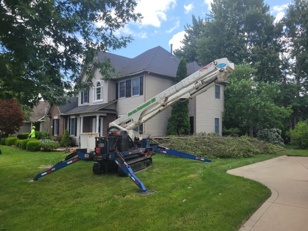A spider lift (tracked aerial lift) used for tree trimming or removal by Ecotree Services LLC in Lorain, OH.