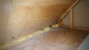 Spray foam insulation applied along a seam in an attic or crawl space, a handyman service by Hometrust Remodeling in Baltimore, MD.