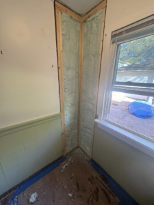 Spray foam insulation being installed in a room corner by NorthStar Insulating Systems, Inc. in Hermantown, MN.