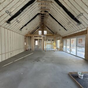 Interior of a new construction building with spray foam insulation applied to walls and ceiling by Koala Insulation of Charlotte, NC