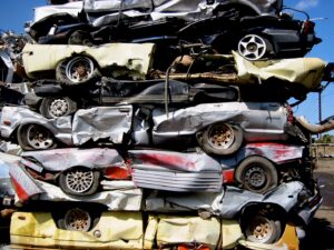 A large stack of crushed cars ready for recycling at SA Recycling - Long Beach Ave in Los Angeles, CA.