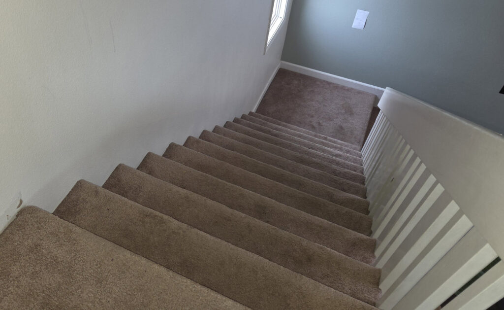 Newly installed carpet on a staircase, a flooring service by Infinity Handyman in Anchorage, AK
