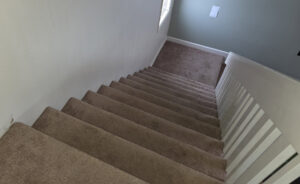 Newly installed carpet on a staircase, a flooring service by Infinity Handyman in Anchorage, AK
