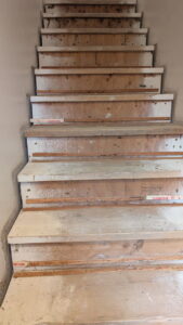 Staircase with old carpet removed, preparing for new flooring installation by Infinity Handyman in Anchorage, AK