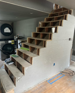 Staircase construction and framing in progress by Spotless & Handyman, LLC in Brockton, MA.
