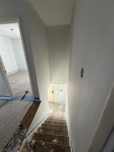 Staircase and hallway painting and renovation services by Building Better Homes Management for homes in Cincinnati, OH.