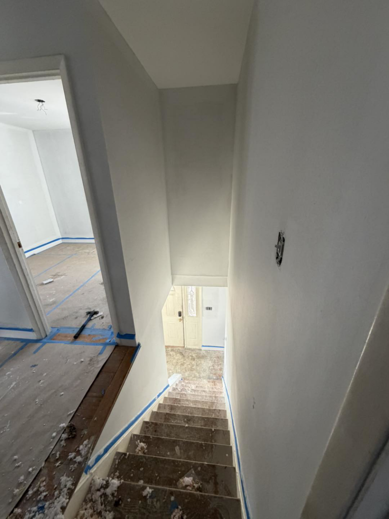Staircase and hallway painting and renovation services by Building Better Homes Management for homes in Cincinnati, OH.