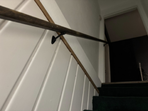 A newly installed staircase handrail and wall paneling by J Webb's Home Improvements LLC in Peoria, IL.