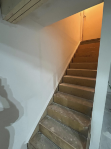 Staircase renovation with new drywall installation by Pinnacle Roofing & Construction LLC in Elkhart, IN.