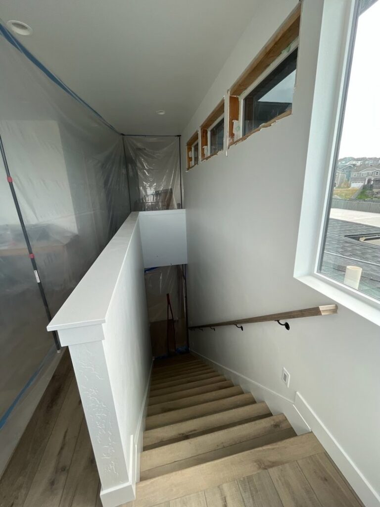 Stairwell renovation in progress with dust protection by Handyman house repairs and remodeling in Provo, UT