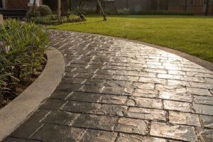 A beautifully installed stamped concrete walkway with a brick-like pattern, by concrete poured & installed - cp&i in Buffalo, NY.