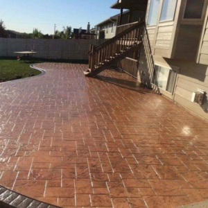 A large stamped concrete patio with a brick-like pattern installed by Lafayette Concrete & Remodel, LLC in Lafayette, IN