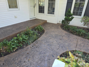 Beautiful stamped concrete walkway and steps leading to a residential entrance by J&M Concrete Construction, LLC in Fayetteville, PA.