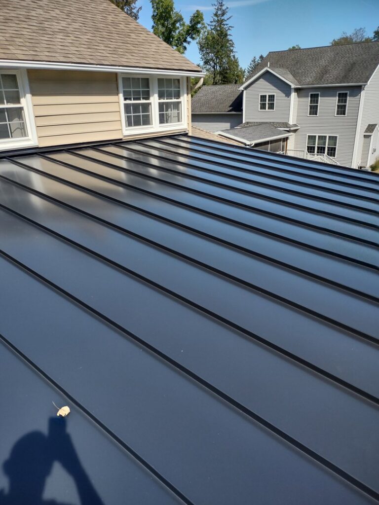 Standing seam metal roof installation on a residential property by JB Home Improvement Services in Sanford, FL.