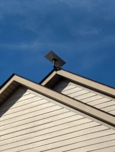 A close-up view of a Starlink satellite dish professionally installed on a residential roof by WX2 Tech in Asheville, NC.