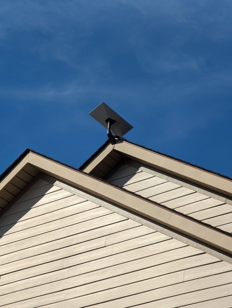 A close-up view of a Starlink satellite dish professionally installed on a residential roof by WX2 Tech in Asheville, NC.