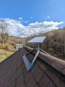 A Starlink satellite dish expertly installed on a roof, showcasing the clean roofline integration by WX2 Tech in Asheville, NC.