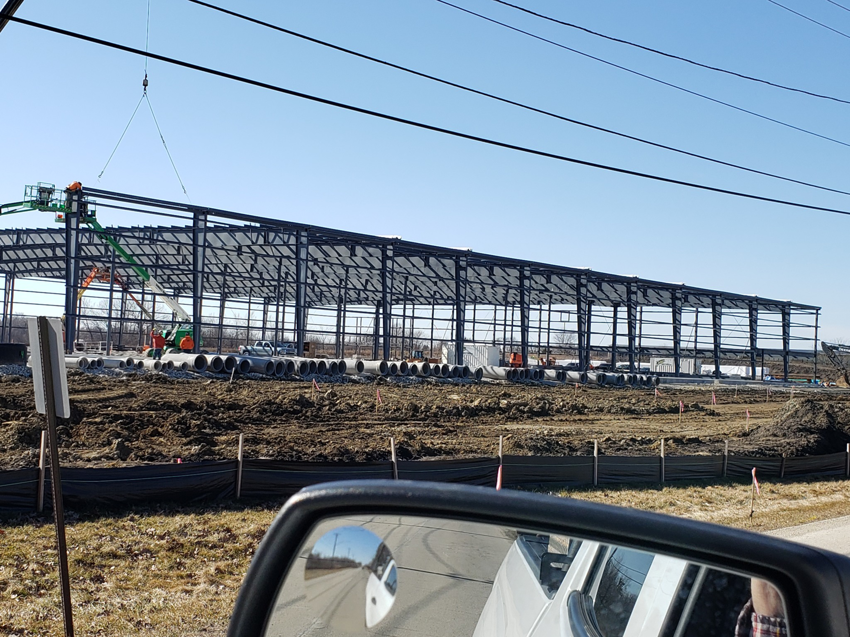 Steel frame of a large commercial building being erected at a construction site by Integrated Building Systems, Inc. in Westmont, IL.