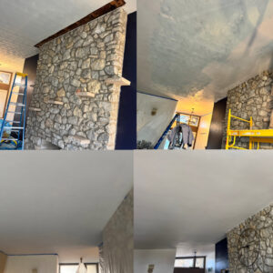Stone fireplace and ceiling painting during a renovation by Tj Drywall & Finishing LLC in Fort Wayne, IN.