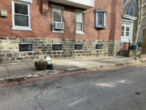 Completed stone foundation masonry work on a brick building by MCG General Contractor in Philadelphia, PA.