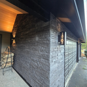 New stone siding, illuminated house number, and outdoor light by Final Touch Construction, LLC in Tukwila, WA
